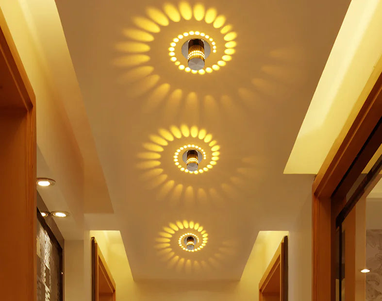 Decorative ceiling lights with circular patterns on a white ceiling