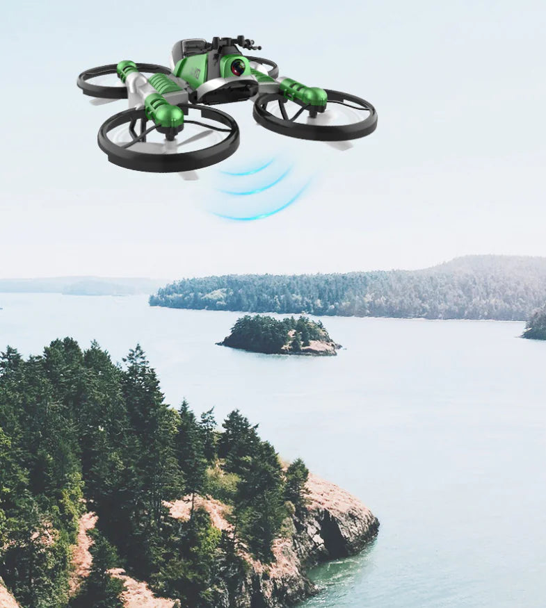 Green drone flying over a scenic landscape with trees and water.