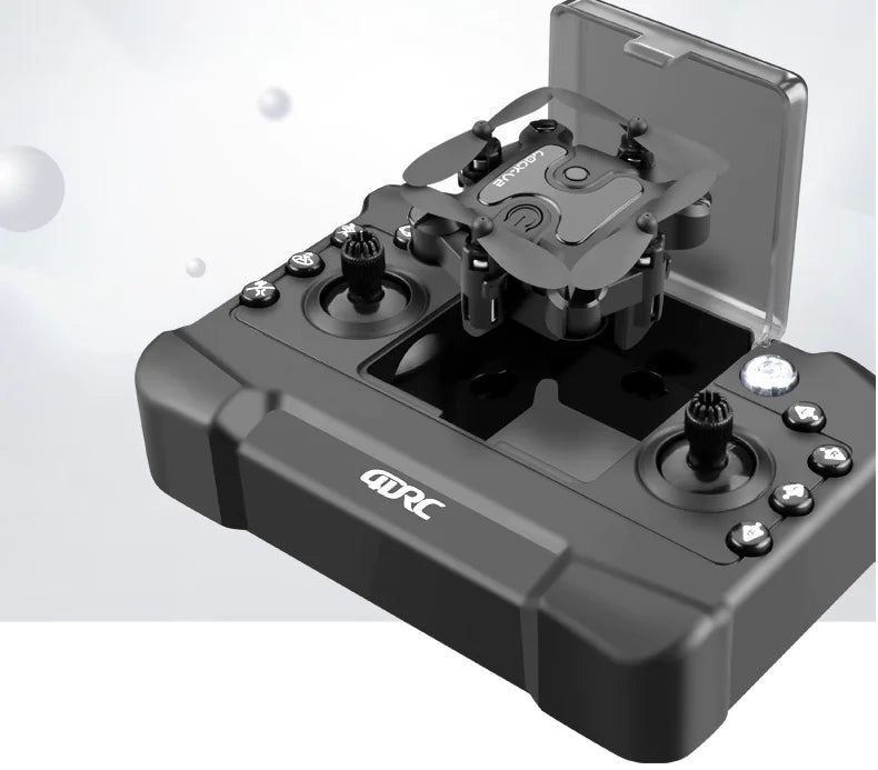 Black RC model airplane on a charging station with 'GRC' branding.