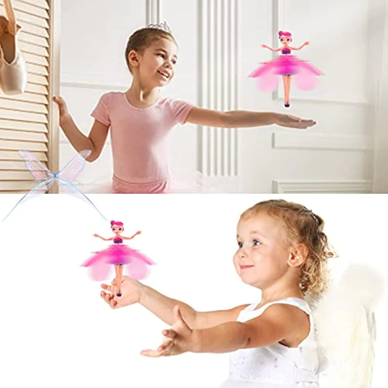 Two children playing with colorful fairy toys against a white background