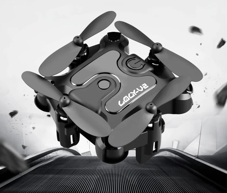 Small drone with folded propellers on a white background