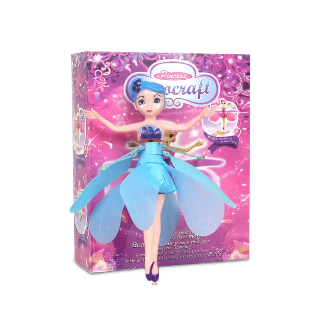 Toy doll with blue hair and dress in front of a pink packaging box